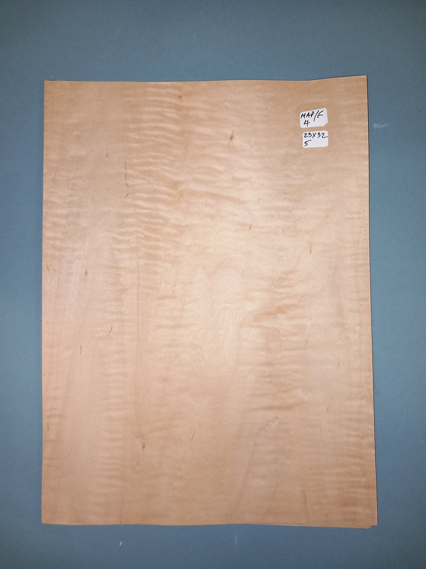 CONSECUTIVE SHEETS OF FIGURED MAPLE VENEER 23 X 32 CM