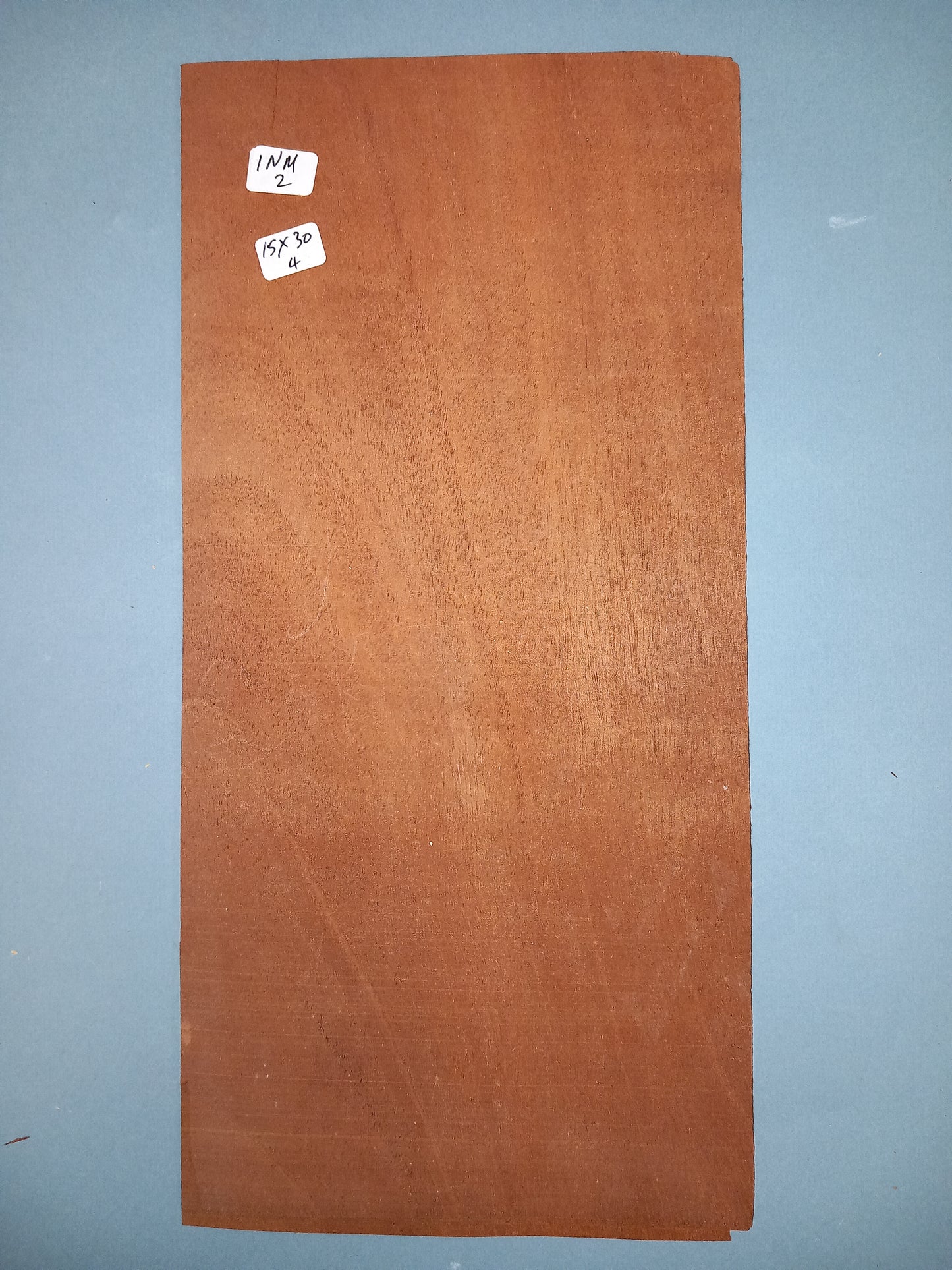CONSECUTIVE SHEETS OF INDIAN MAHOGANY VENEER 15 X 30 CM