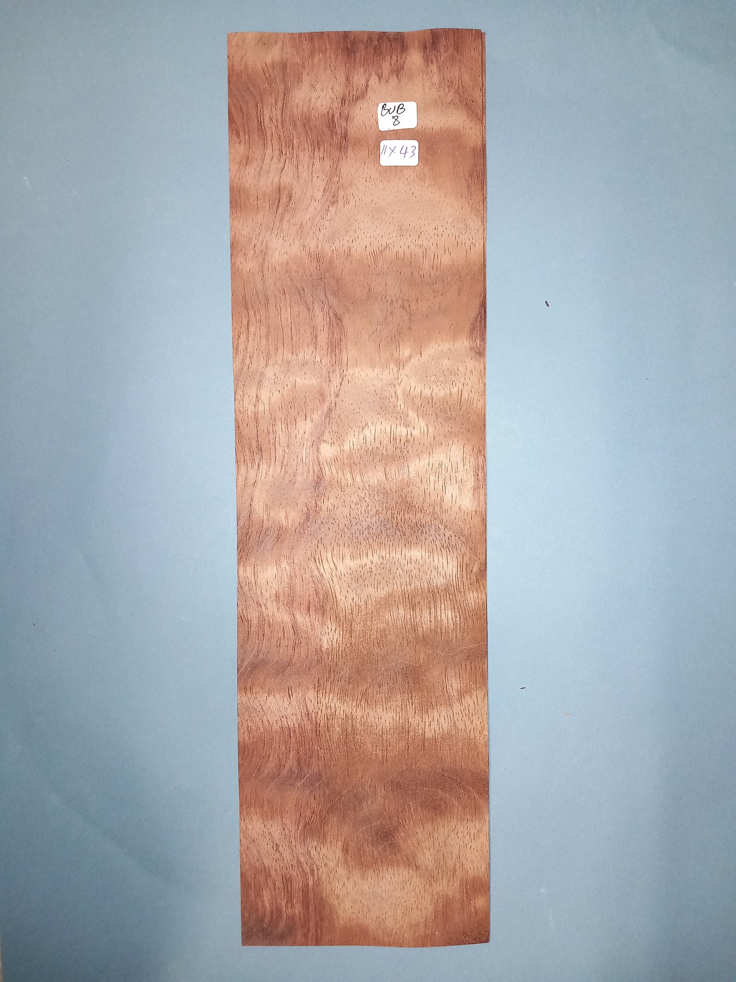 CONSECUTIVE SHEETS OF BUBINGA VENEER 11 X 43 CM