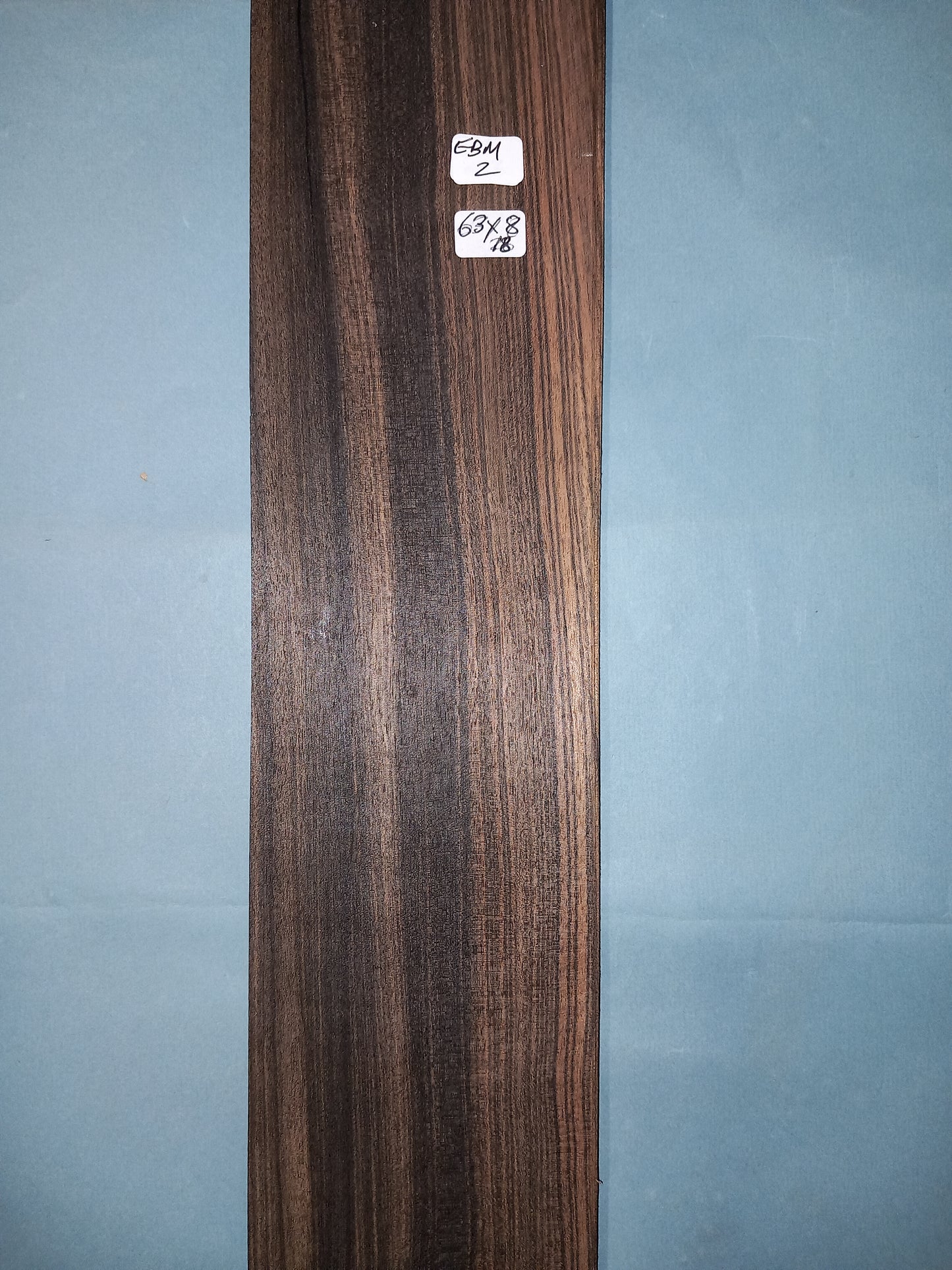 CONSECUTIVE SHEETS OF EBONY/MACASSAR VENEER 63 X 8 CM
