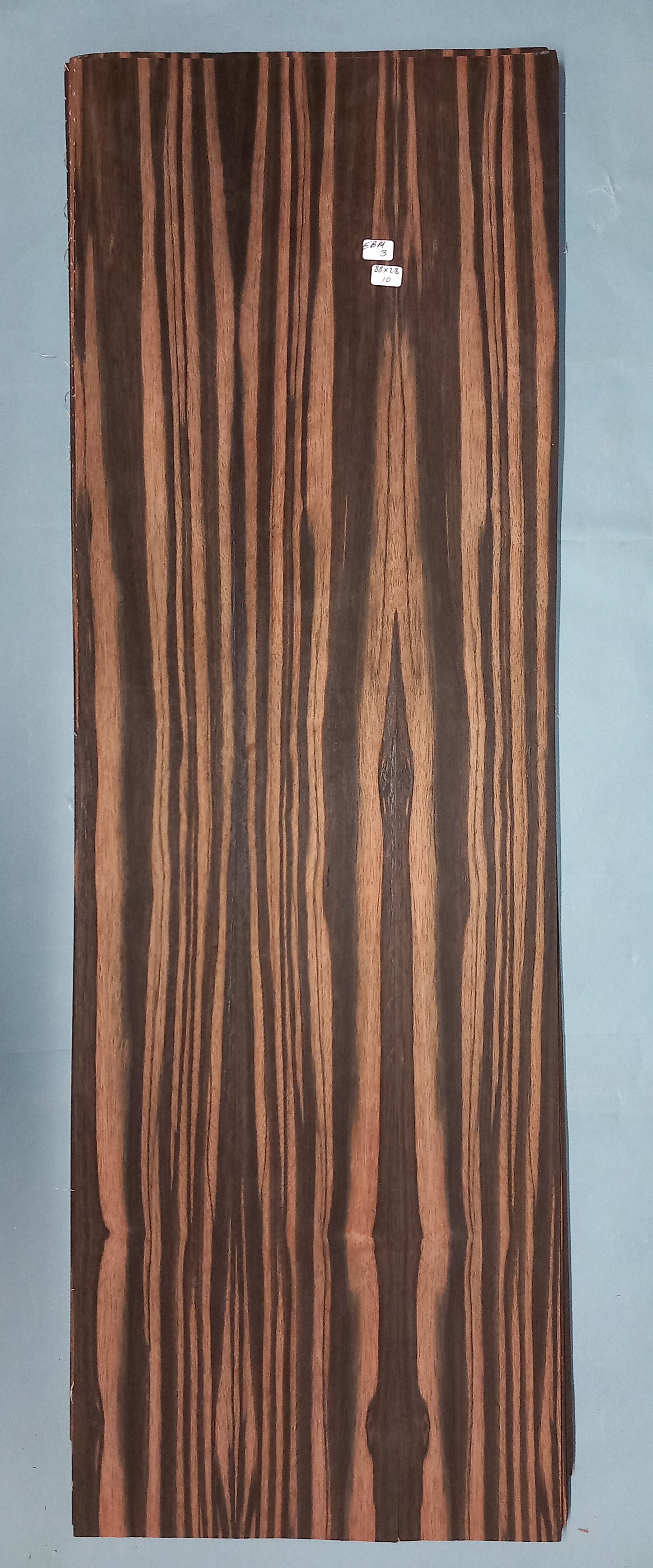 LARGE CONSECUTIVE SHEETS OF EBONY/MACASSAR VENEER 88 X 28 CM