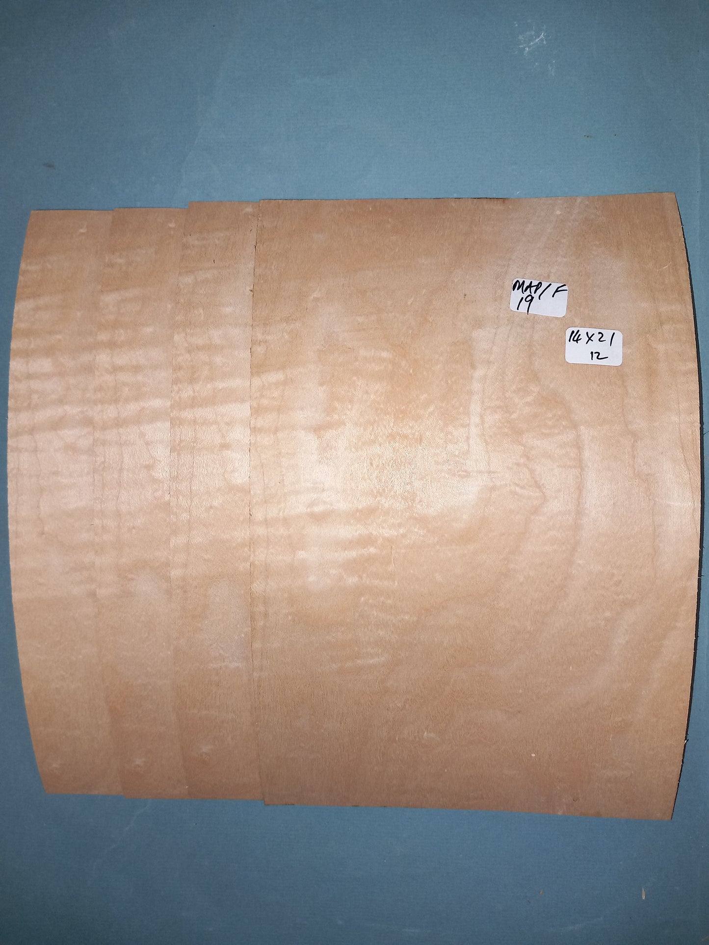 4 CONSECUTIVE SHEETS OF FIGURED MAPLE VENEER 14 X 21 CM