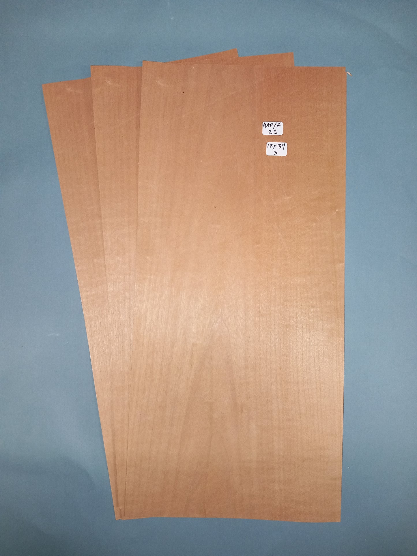 3 CONSECUTIVE SHEETS OF FIGURED MAPLE VENEER 17 X 39 CM